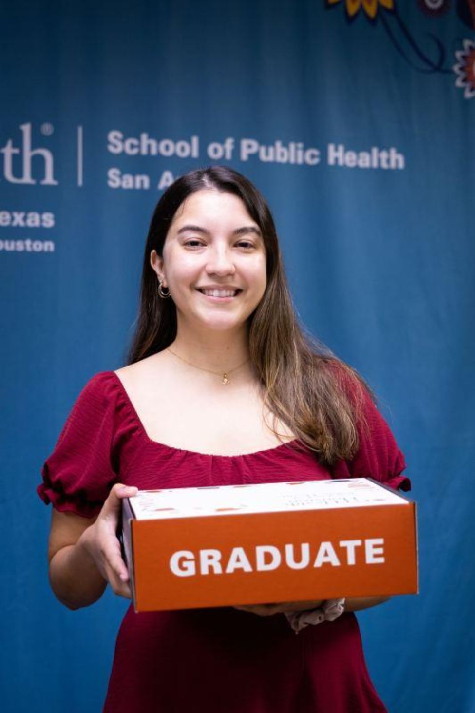 Asha Collier, MPH, alumni of UTHealth Houston School of Public Health in San Antonio at her graduation celebration in December, 2023.